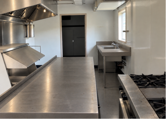 A kitchen with stainless steel appliances AI-generated content may be incorrect.